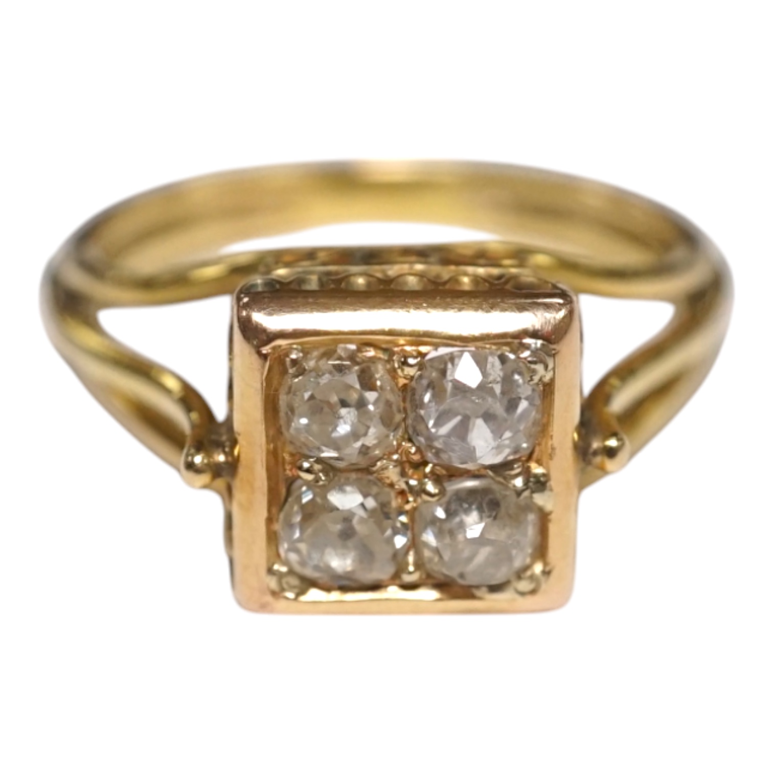 A yellow metal and four stone old mine cut diamond set square cluster ring, size O, gross weight 4.5 grams. Condition - fair to good